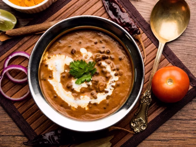 dal-makhani-makhni-is-popular-dish-from-india-made-with-ingredients-like-whole-black-lentil-butter-cream-served-with-naan-roti-rice_466689-6756